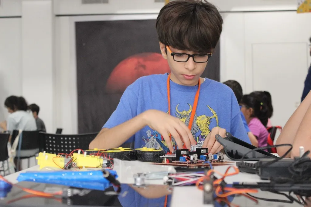 Student building Arduino-based rover circuit